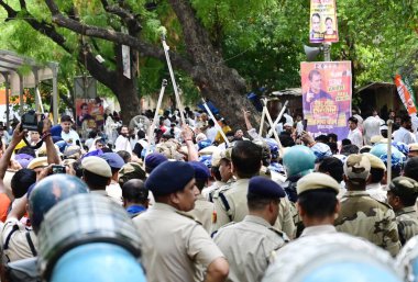 NEW DELHI INDIA JUNE 27 2024 IYC supporters shout slogans holding placards as they detained by the police during protest against NTA and re examination of NEET Exams by Indian Youth Congress at Jantar Mantar on June 27 2024 in New Delhi India Indian  clipart