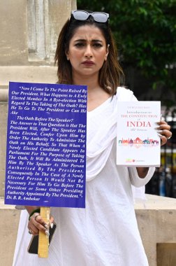 KOLKATA INDIA JUNE 27 2024 Two newly elected Trinamool Congress TMC MLA in West Bengal Sayantika Banerjee hold a protest 2nd day in front of the statue of B R Ambedkar at the Assembly premises after West Bengal Governor CV Ananda Bose refused to acce clipart