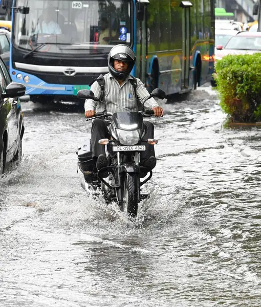 stock image NEW DELHI INDIA JUNE 27 2024 Vehicles wades through logged rain water at ITO on June 27 2024 in New Delhi India The India Meteorological Department IMD has predicted the arrival of monsoon over large parts of northwest India over the next three to fo