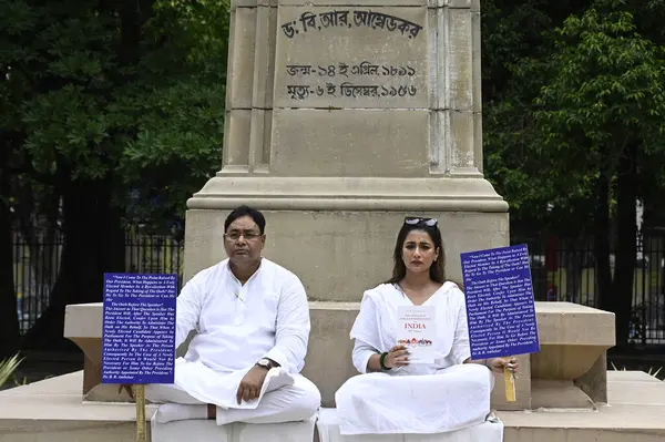 stock image KOLKATA INDIA JUNE 27 2024 Two newly elected Trinamool Congress TMC MLA in West Bengal Sayantika Banerjee and Rayat Hossain Sarkar hold a protest 2nd day in front of the statue of B R Ambedkar at the Assembly premises after West Bengal Governor CV An