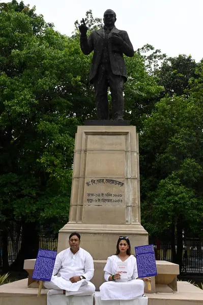 stock image KOLKATA INDIA JUNE 27 2024 Two newly elected Trinamool Congress TMC MLA in West Bengal Sayantika Banerjee and Rayat Hossain Sarkar hold a protest 2nd day in front of the statue of B R Ambedkar at the Assembly premises after West Bengal Governor CV An