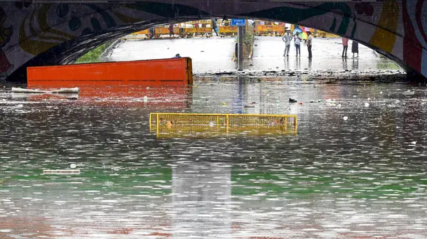 stock image NEW DELHI INDIA JUNE 28 2024 Commuters wade through water logging at Dabri Gurugram road Dwarka on June 28 2024 in New Delhi India Indias national capital Delhi received its heaviest rain for the month of June in 88 years with roads being flooded