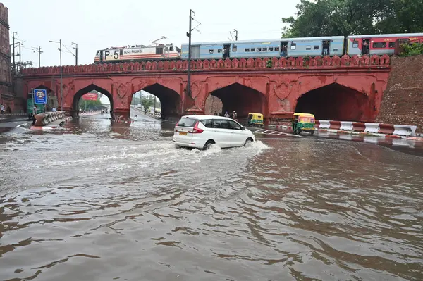 stock image NEW DELHI INDIA JUNE 28 2024 Commuters wade through water logging at Dabri Gurugram road Dwarka on June 28 2024 in New Delhi India Indias national capital Delhi received its heaviest rain for the month of June in 88 years with roads being flooded