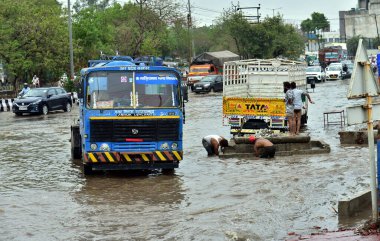 GHAZIABAD INDIA JUNE 29 2024 Due to rain this morning Pandav Nagar road was filled with rainwater Municipal Corporation employees were draining out the water on June 29 2024 in Ghaziabad India The India Meteorological Department IMD predicts heavy to clipart