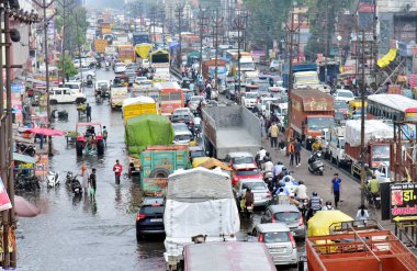 GHAZIABAD INDIA JUNE 29 2024 Due to rain this morning the lal kuan road was filled with rainwater and there was a heavy traffic jam on June 29 2024 in Ghaziabad India The India Meteorological Department IMD predicts heavy to very heavy rainfall in De clipart