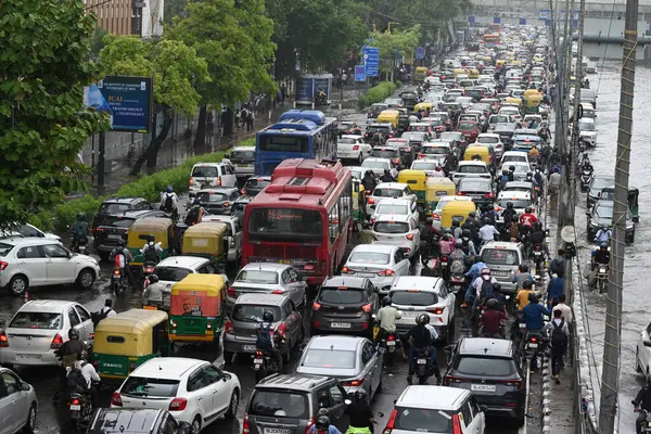 stock image NEW DELHI INDIA JUNE 28 2024 Commuters wade through water logging at Dabri Gurugram road Dwarka on June 28 2024 in New Delhi India Indias national capital Delhi received its heaviest rain for the month of June in 88 years with roads being flooded