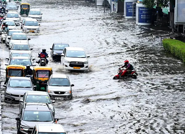 stock image NEW DELHI INDIA JUNE 28 2024 Commuters wade through water logging at Dabri Gurugram road Dwarka on June 28 2024 in New Delhi India Indias national capital Delhi received its heaviest rain for the month of June in 88 years with roads being flooded