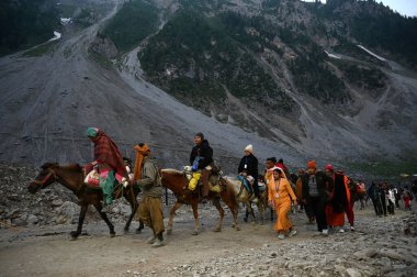 SRINAGAR INDIA JUNE 29 2024 First batch of the Amarnath pilgrims on their way to the Amarnath cave on the Baltal route northeast of Srinagar on June 29 2024 in Srinagar India The annual Amarnath Yatra began on Saturday as the first batch of pilgrims  clipart