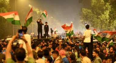 NEW DELHI INDIA JUNE 30 2024 Fans celebrate on a road near the India Gate after India won the T20 World Cup 2024 on June 30 2024 in New Delhi India Celebrations erupted Saturday night across cricketcrazy India as its team won the T20 World Cup with f clipart