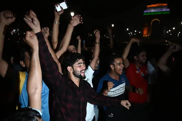 stock image NEW DELHI INDIA JUNE 30 2024 Fans celebrate on a road near the India Gate after India won the T20 World Cup 2024 against South Africa on June 30 2024 in New Delhi India Celebrations erupted Saturday night across cricketcrazy India as its team won the