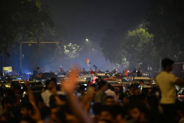 NEW DELHI INDIA JUNE 30 2024 Fans celebrate on a road near the India Gate after India won the T20 World Cup 2024 against South Africa on June 30 2024 in New Delhi India Celebrations erupted Saturday night across cricketcrazy India as its team won the clipart