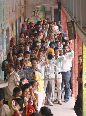 CHANDIGARH INDIA JUNE 1 2024 Voters in a Long Queue to Cast their vote for Loksabha election at one of the polling stations at government school in village Burial of sector 45 on June 1 2024 in Chandigarh India Photo by Ravi Kumar Hindustan Times  clipart