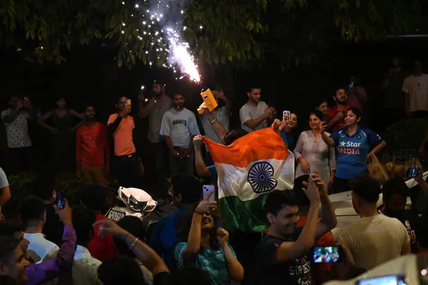 stock image NEW DELHI INDIA JUNE 30 2024 Fans celebrate on a road near the India Gate after India won the T20 World Cup 2024 against South Africa on June 30 2024 in New Delhi India Celebrations erupted Saturday night across cricketcrazy India as its team won the