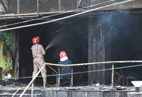 stock image NEW DELHI, INDIA - JUNE 5 2024 Delhi fire officials trying to control a fire at Eye 7 Hospital on Lajpat Nagar Ring Road on June 5, 2024 in New Delhi, India. A major fire broke out at a two-storey building housing an eye hospital in Lajpat Nagar alon