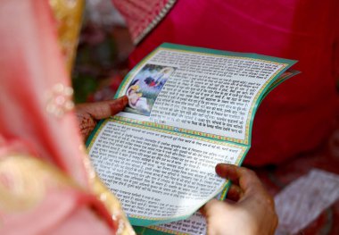 NOIDA, INDIA - JUNE 6 2024 Devotees offer prayers under a tree on the occasion of 'Vat Savitri Puja', at a Shiv mandir in sector 22, on June 6, 2024 in Noida, India. (Photo by Sunil Ghosh/Hindustan Times)  clipart