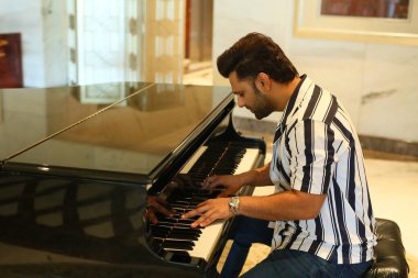 NEW DELHI, INDIA JUNE 8 2024    Bollywood singer Rahul Vaidya poses  on World Music Day special shoot, on June 8, 2024 in New Delhi, India. singer Rahul Vaidya settles in to reflect on his journey as a solo artist and the role music plays in his life clipart