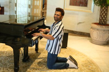 NEW DELHI, INDIA JUNE 8 2024    Bollywood singer Rahul Vaidya poses  on World Music Day special shoot, on June 8, 2024 in New Delhi, India. singer Rahul Vaidya settles in to reflect on his journey as a solo artist and the role music plays in his life clipart