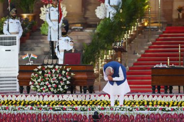 NEW DELHI, INDIA JUNE 9 2024   Prime Minister Narendra Modi gestures before taking oath as the Prime Minister of India for third consecutive term, at the forecourt of Rashtrapati Bhavan on June 9, 2024 in New Delhi, India. Narendra Modi took over as  clipart