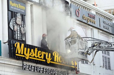 NEW DELHI, INDIA JUNE 9 2024   Firefighters try to douse a fire that broke out at the Mystery Rooms, a theme-based adventure game zone, at Connaught Place, on June 9, 2024 in New Delhi, India. The cause of the fire has yet to be determined. More deta clipart