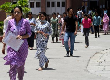 NOIDA, INDIA JUNE 9 2024   Candidates leave after appearing for the Uttar Pradesh B.Ed. entrance exam, at Rajkiya Balika Inter College in Sector 51, on June 9, 2024 in Noida, India. (Photo by Sunil Ghosh/Hindustan Times  clipart