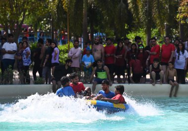 NOIDA, INDIA JUNE 11 2024   People enjoy at a water park in GIP Mall on a hot sunny day, as the temperature rises in the Delhi-NCR, on June 11, 2024 in Noida, India. (Photo by Sunil Ghosh/Hindustan Times  clipart