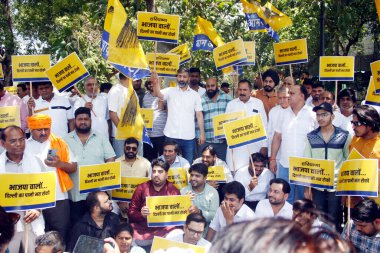 SahNEW DELHI, INDIA JUNE 10 2024   AAP party supporters with banners shous slogans against Haryana Govt to release more water at Haryana Bhawan on June 10, 2024 in New Delhi, India. Speaking on the Delhi water crisis, AAP alleged that BJP-led Haryana clipart