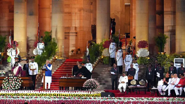 stock image NEW DELHI, INDIA JUNE 9 2024   President Droupadi Murmu administers oath of Prime Minister Narendra Modi for the third consecutive term during a swearing-in ceremony, at the forecourt of Rashtrapati Bhavan on June 9, 2024 in New Delhi, India. Narendr