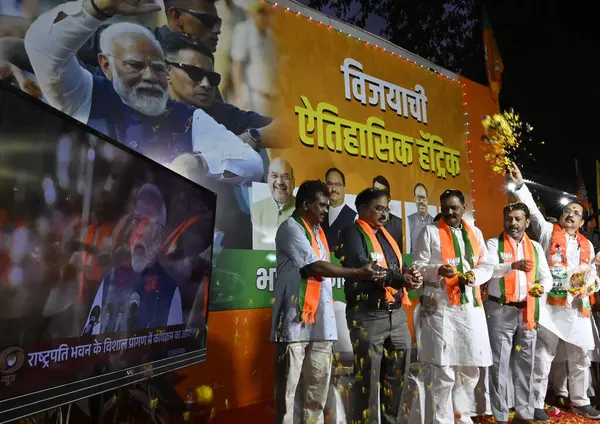 stock image MUMBAI, INDIA JUNE 9 2024   BJP party workers celebrate outside BJP office, while PM Narendra Modi takes his oath as new Prime Minister of India, at Nariman Point, on June 9, 2024 in Mumbai, India. Newly-elected PM Narendra Modi is all set to become 