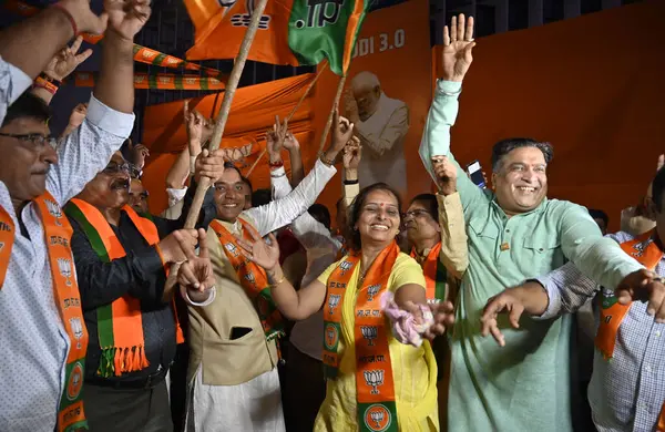 stock image MUMBAI, INDIA JUNE 9 2024   BJP party workers celebrate outside BJP office, while PM Narendra Modi takes his oath as new Prime Minister of India, at Nariman Point, on June 9, 2024 in Mumbai, India. Newly-elected PM Narendra Modi is all set to become 