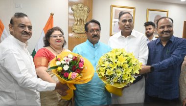 NEW DELHI INDIA JUNE 12 2024   Harsh Malhotra with his wife and South Delhi MP Ramvir Singh Bidhuri MLA OPSharma Abhay Verma assume to take charge as MOS Road & Transport minister at Transport ministry at Transport Bhawan on June 12 2024 in New Delhi clipart