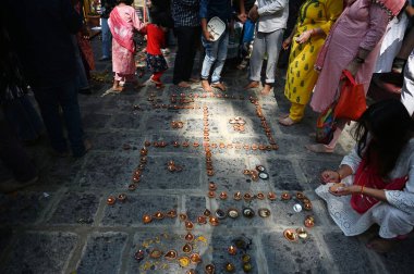 GANDERBAL INDIA JUNE 14 2024   Kashmiri Pandit devotees performs rituals during the annual Hindu festival in the Kheer Bhawani Temple at Tullamulla on June 14 2024 in Ganderbal India. . Photo by Waseem Andrabi/Hindustan Times  clipart