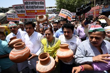 NEW DELHI INDIA JUNE 15 2024   Delhi Congress workers during Matka Phod protest against the Delhi Government over the shortage of water at Yusuf Sarai on June 15 2024 in New Delhi India.  Photo by Salman Ali/Hindustan Times  clipart