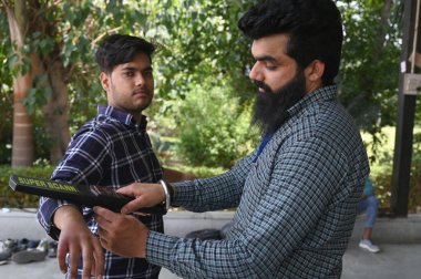 GURUGRAM INDIA MAY 7 2023 A National Eligibility cum Entrance Test NEET candidates stand in a queue for thermal screening before entering the examination centre in Drona Public School at Ravi Nagar Basai Road near Government college sector 9 on May 7