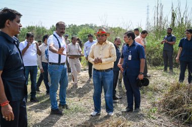 NEW DELHI INDIA MAY 7 2023 Vinai Kumar Saxena Lieutenant Governor of Delhi inspects the Chinar Island during his visit to Mini Islands that are being rejuvenated by the authorities in Yamuna River near Yamuna Bazaar on May 7 2023 in New Delhi India P clipart