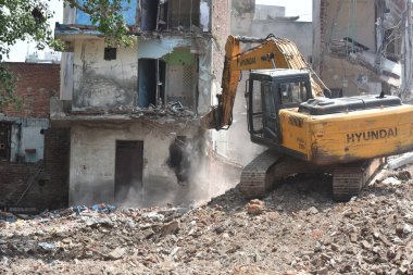 NEW DELHI INDIA MAY 31 2023 Demolition drive by DDA on illegal construction at DDA Land at Kasturba Nagar on May 31 2023 in New Delhi India Photo by Sonu Mehta Hindustan Times  clipart