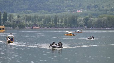 SRINAGAR INDIA MAY 18 2023 Indian Navy s Marine Commandos patrol on the waters of Dal Lake on May 18 2023 in Srinagar India Security is being beefed up ahead of the G20 Tourism Working Group meeting of delegates from G20 nations is being held in Srin clipart