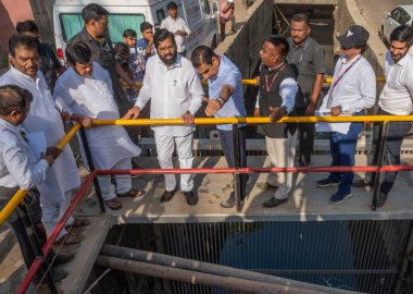 MUMBAI INDIA MAY 19 2023 State of Maharashtra Hon Chief Minister Eknath Shinde along with Brihanmumbai Municipal Corporation Commissioner and Administrator Iqbal Singh Chahal inspecting the desilting works at Milan Subway on May 19 2023 in Mumbai Ind clipart