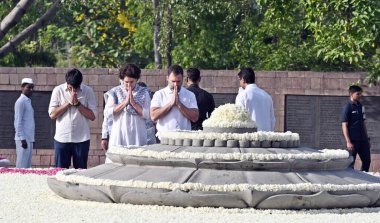 NEW DELHI INDIA MAY 21 2023 Congress leader Rahul Gandhi Priyanka Gandhi Vadra with her son Raihan Vadra paying tribute to former prime minister Rajiv Gandhi on his 32nd death anniversary at his memorial Veer Bhumi on May 21 2023 in New Delhi India T clipart