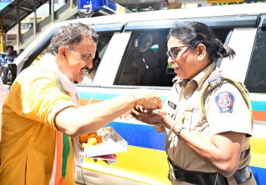 MUMBAI INDIA MAY 14 2023 Mumbai Congress President Bhai Jagtap and party leader Sanjay Nirupam along with party workers celebrate the party s victory in Karnataka assembly elections by distributing sweets at Andheri on May 14 2023 in Mumbai India Con clipart