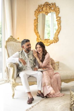 NEW DELHI, INDIA - AUGUST 16, 2023: Bollywood Actress Radhikka Madan with her brother, businessman Arjun Madan pose during an exclusive interview with HT City for the Raksha Bandhan celebrations clipart