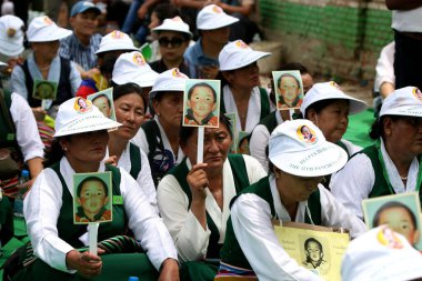 NEW DELHI INDIA MAY 17 2023 Tibetan Women association hold placards during their protest against the Chinese government on the 28 year of the enforced disappearance of the 11th Panchen Lama Tenzin Gendun Yeshi Thinley Phuntsok at Jantar Mantar on May clipart