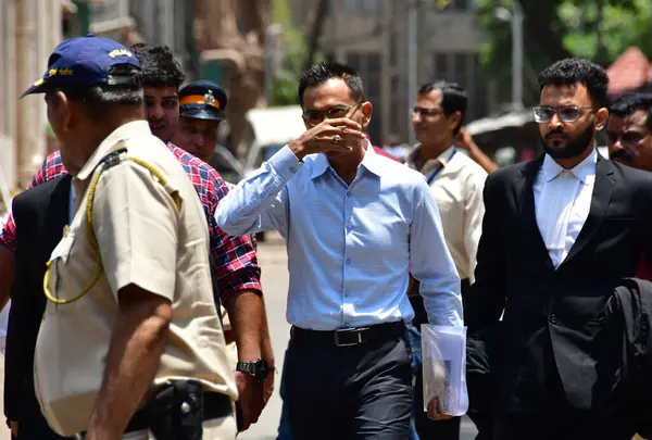 stock image MUMBAI INDIA MAY 22 2023 Former Zonal Director of Mumbai Narcotics Control Bureau Sameer Wankhede being escorted outside the Bombay High Court after the court extended his interim protection against coercive action in the bribery case in connection w