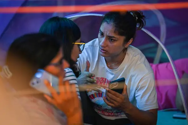 stock image NEW DELHI INDIA MAY 4 2023 Vinesh Phogat Indian Wrestler seen along DCW Chief Swati Maliwal during the ongoing protest by Indian Wrestlers against the President of Wrestling Federation of India at Jantar Mantar on May 4 2023 in New Delhi India Speaki