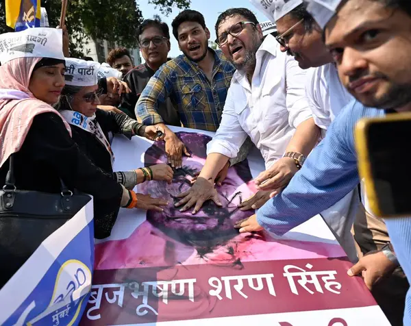 stock image MUMBAI INDIA MAY 6 2023 Aam Admi Party AAP workers protest against Wrestling Federation of India WFI president and BJP MP Brij Bhushan Sharan Singh over allegations of sexual harassment by Indian women wrestlers at Kadam Nagar Behram Baug Jogeshwari 