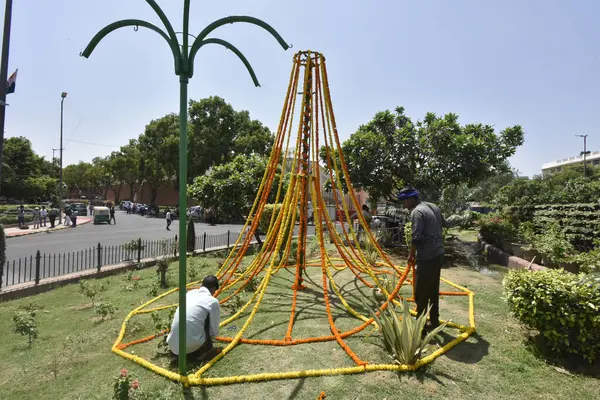 stock image NEW DELHI INDIA MAY 27 2023 Workers doing preparation outside the new Parliament ahead of the inauguration of the new Parliament building by Prime Minister Narendra Modi on Sunday on May 27 2023 in New Delhi India The new Parliament is all decked up 