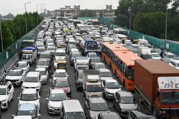 stock image NEW DELHI, INDIA - AUGUST 23, 2024: Traffic Jam at Sardar Patel Marg near Dhaula Kuan Metro Station and Ring road due to waterlogging under Dhaula Kuan flyover after heavy rain, on August 23, 2024 in New Delhi, India.