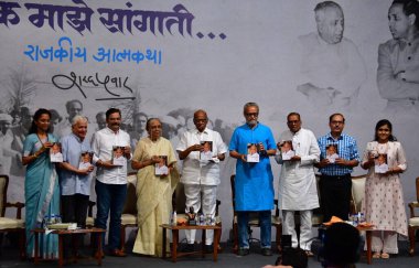 MUMBAI INDIA MAY 2 2023 Nationalist Congress Party NCP chief Sharad Pawar with his wife at the launch of the second part of his autobiography Lok Majhe Sangati Political Autobiography made the announcement of his retirement at Y B Chavan Centre Narim clipart