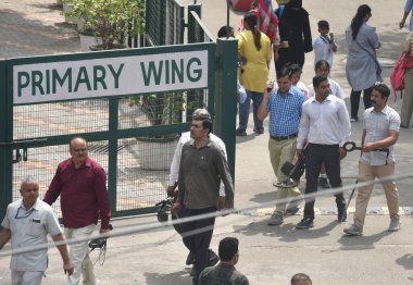 NEW DELHI INDIA: APRIL 26, 2023 - Delhi Police Bomb Detection Team searching after receiving a bomb threat at Delhi Public School DPS Mathura Road on April 26, 2023 in New Delhi, India. clipart