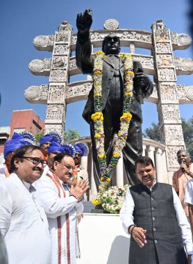 MUMBAI INDIA MAY 17 2023 BJP National President JP Nadda with Maharashtra Deputy Chief Minister Devendra Fadnavis and others after garlanding a statue of BR Ambedkar at Ghatkopar on May 17 2023 in Mumbai India Photo by Vijay Bate Hindustan Times  clipart