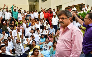 MUMBAI INDIA MAY 4 2023 NCP leader Jitendra Awhad along with workers and supporters of Sharad Pawar stage a protest urging him to reconsider his resignation at Y B Chavan Centre Nariman Point on May 4 2023 in Mumbai India Photo by Bhushan Koyande Hin clipart